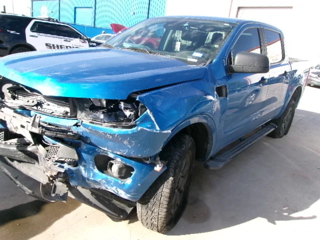 Blue truck collision damage before repair
